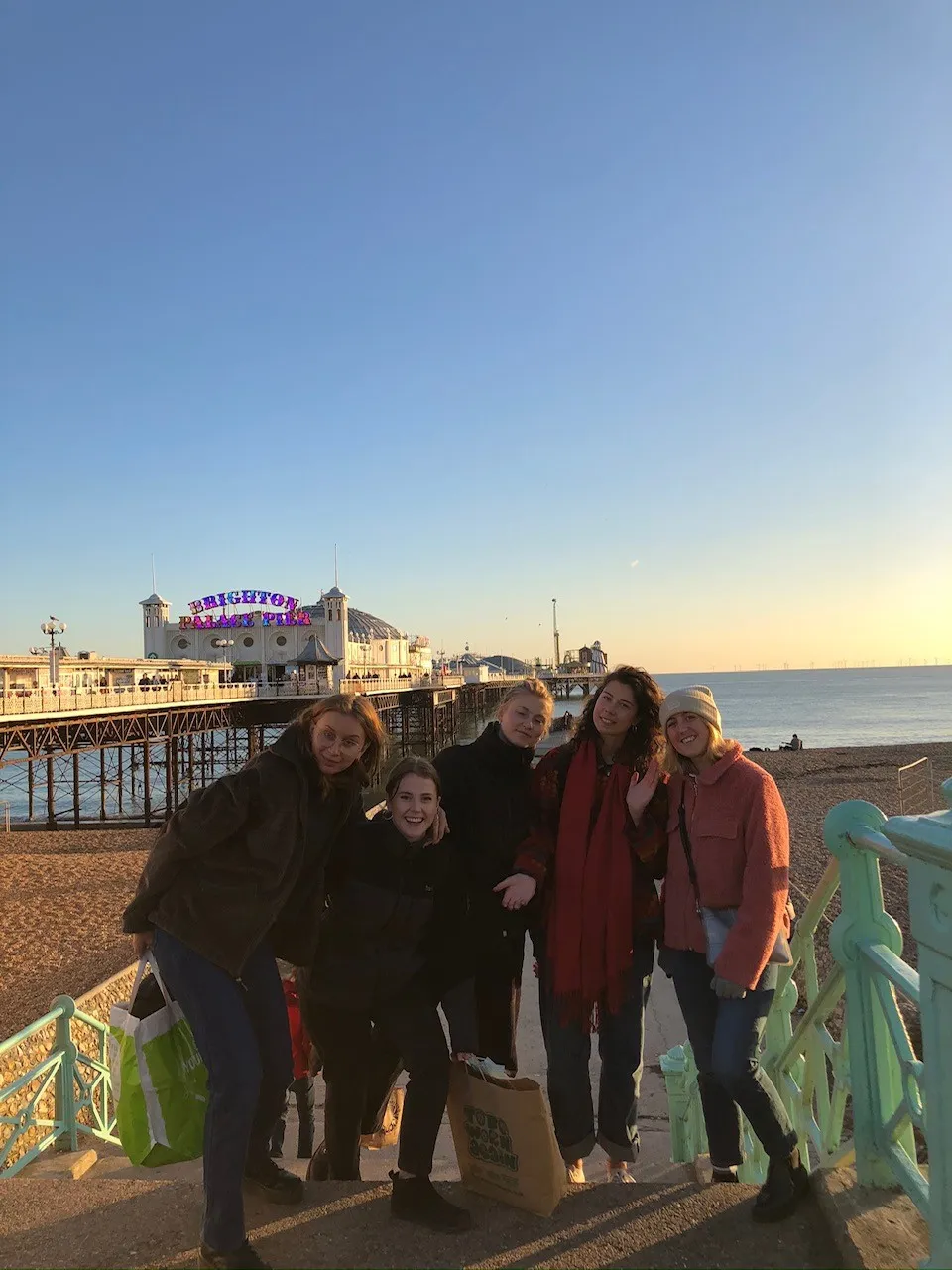 Five Loxdale students posing together on Brighton seafront with the iconic Brighton Pier in background