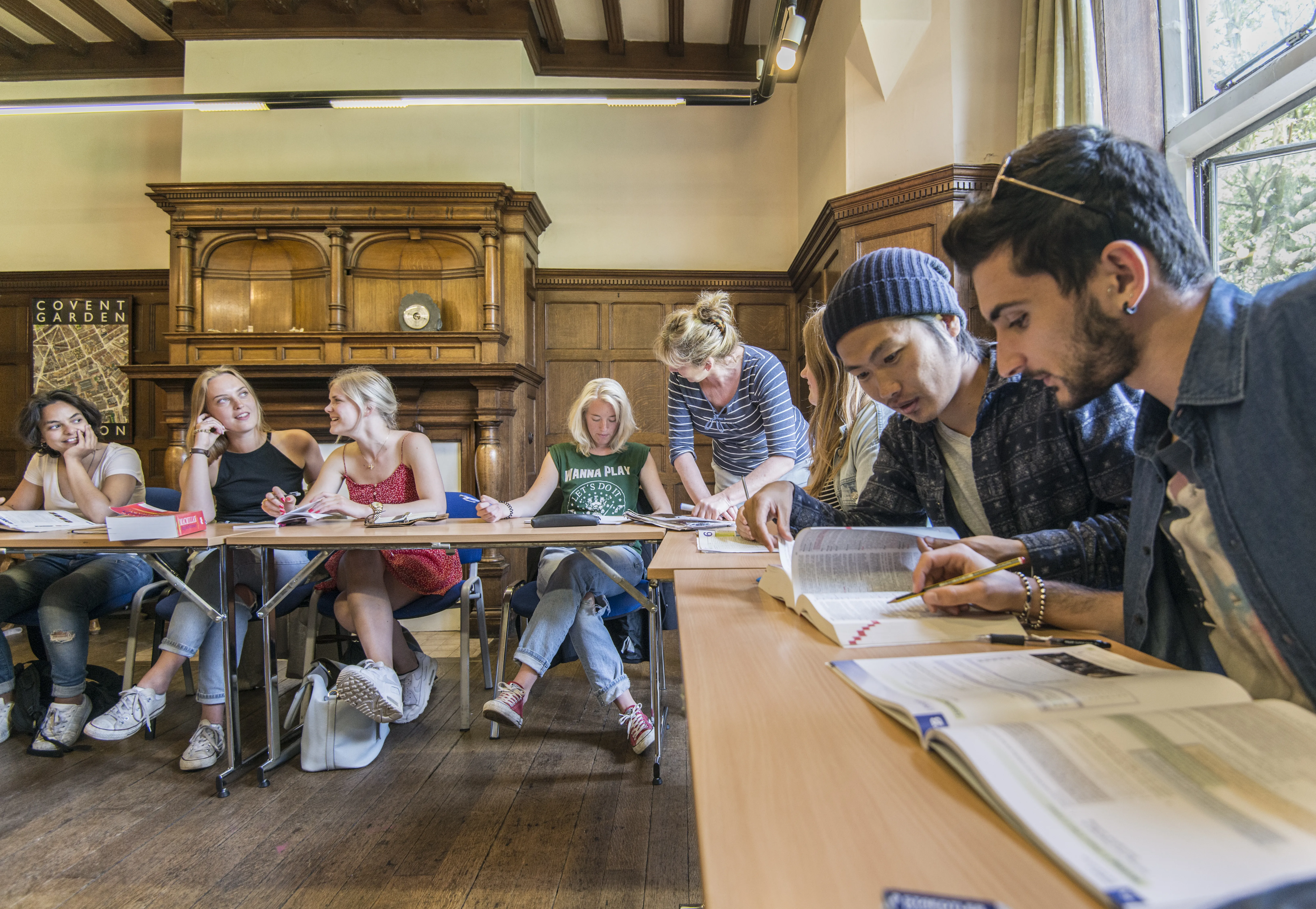 Small group English lesson at Loxdale language school in Brighton with students studying in historic classroom