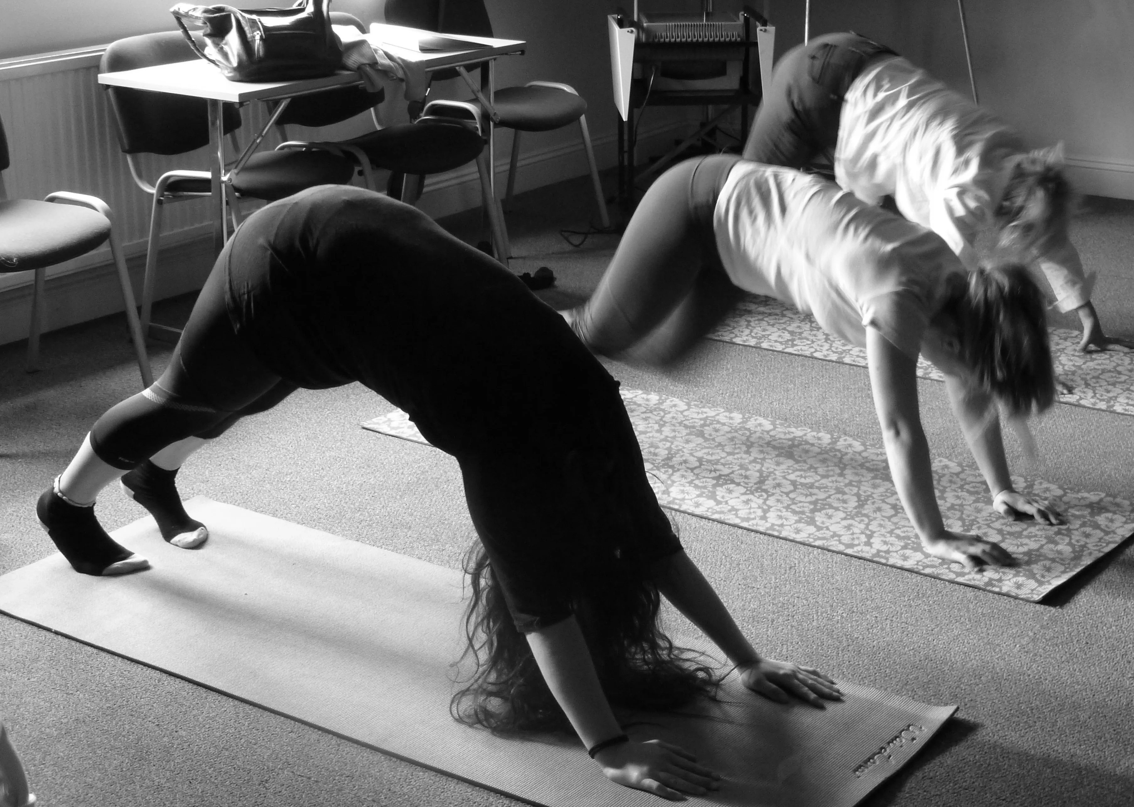 Students practising yoga during the English with Health and Wellbeing course at Loxdale Brighton