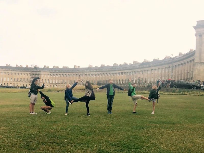 Loxdale English students holding hands in a line during group activity excursion