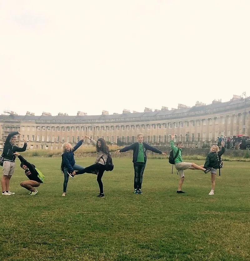 Loxdale English students holding hands in a line during group activity excursion