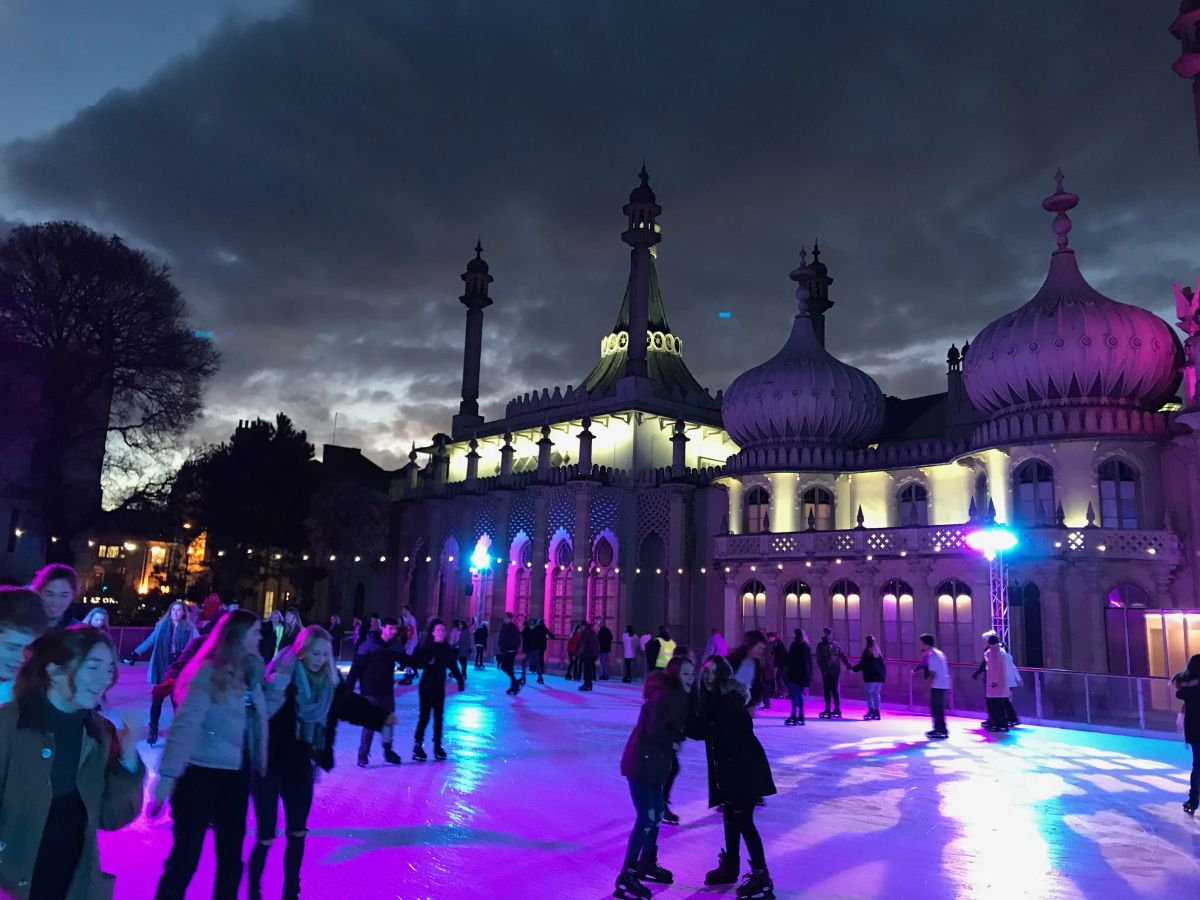 Skaters on the winter ice rink at the Royal Pavilion, Brighton