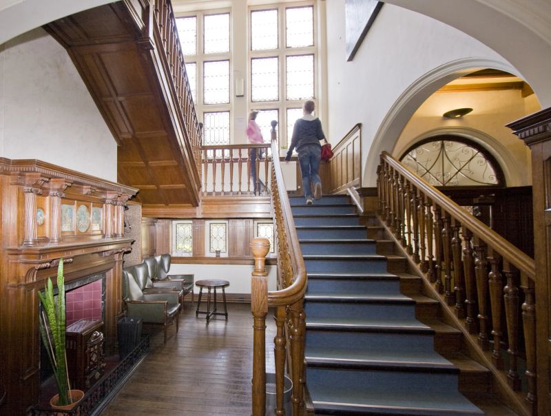 Historic wooden staircase and main hallway at Loxdale English Centre