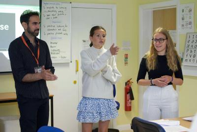 Teacher and two students in small-group English lesson at Loxdale language school in Brighton UK