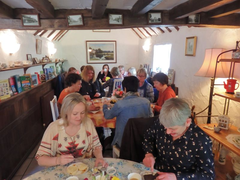 40+ English students enjoying traditional British cream tea at Loxdale Brighton