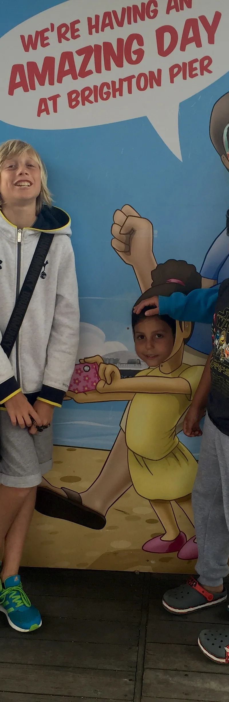 Pre-teen students having fun on Brighton Pier during Loxdale summer course excursion