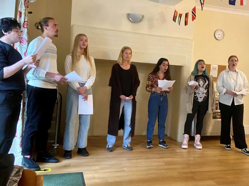 Students performing in English class at Loxdale language school in Brighton, practicing speaking skills