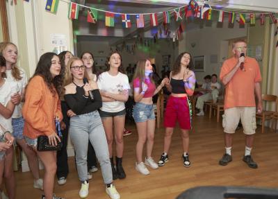 Students participating in karaoke evening at Loxdale English Centre Brighton