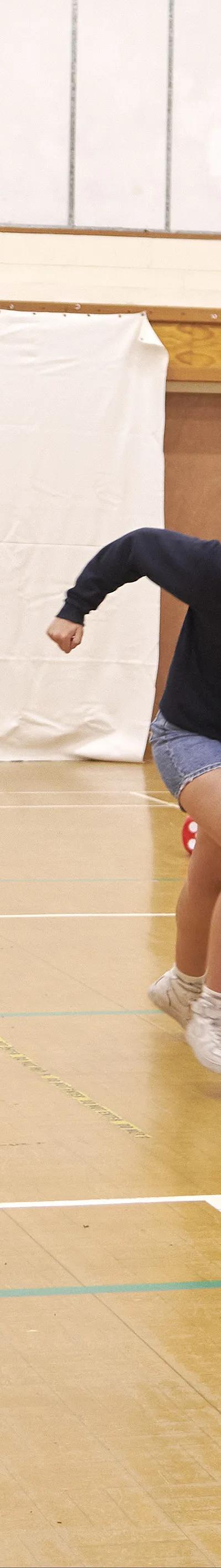 Students playing tug of war in gymnasium at Loxdale English Centre Brighton