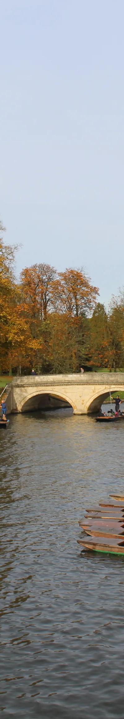 Students punting on River Cam in Cambridge during autumn English language school trip