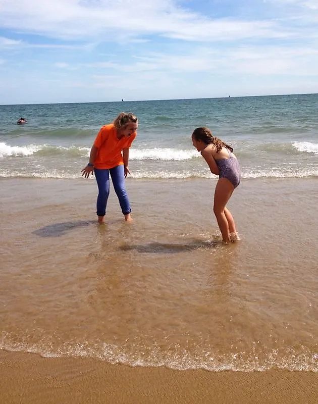 Young learners exploring Brighton beach during summer English course excursion